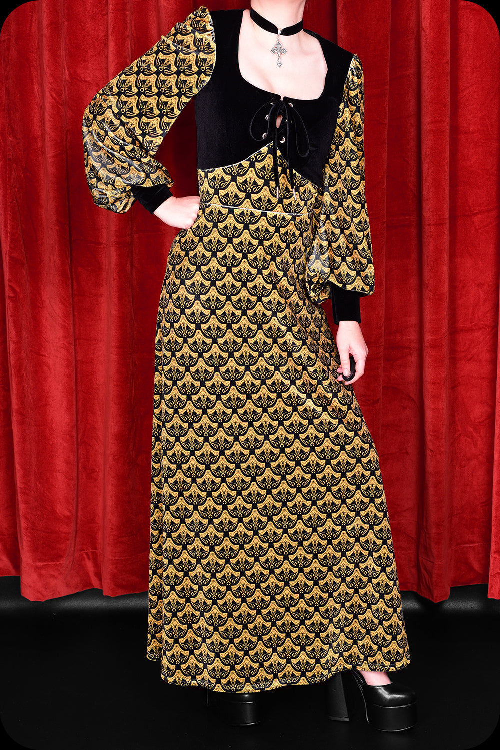 A gold logo print velvet Carmilla maxi dress by Scorpio Rising