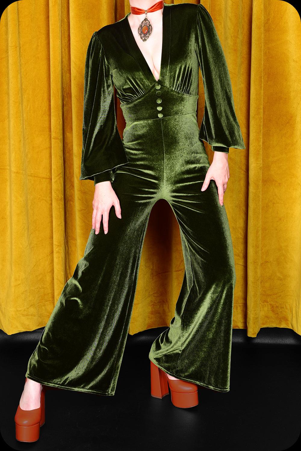 A green velvet Suspiria jumpsuit by Scorpio Rising